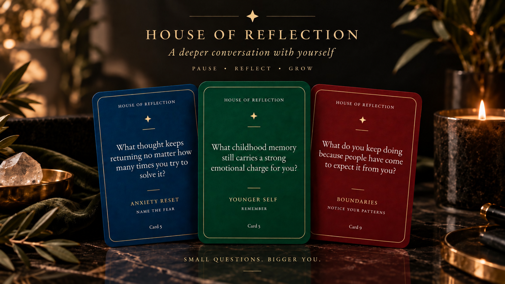 House of Reflection — Anxiety Reset, Younger Self, and Boundaries cards standing on a dark marble surface beside a candle